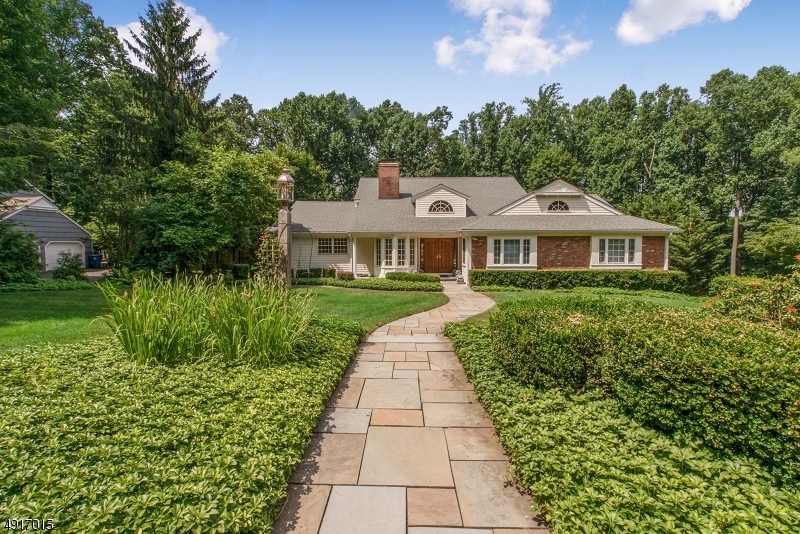Spacious & elegant contemporary expanded ranch sits on a .5 acre of sumptuously landscaped property in Morristown, close to schools, restaurants, the train near The Green & easy access to highways. This exceptional home w 5 bed 5.1 baths, 2-car garage, elevator,  built-ins for storage & display & an open, airy floor plan w oversized windows. 2-story foyer opens to an expansive living room w vaulted ceilings & views of the outdoors & an formal dining room. The modern kitchen features custom cabinets w horizontal lines, high end stainless appliances, silestone counters, center island & breakfast nook. The master bedroom boasts a sitting room w access to a deck, a private bath & two walk-in closets, 3 additional bedrooms, one w an ensuite bath & a full bath & powder room.