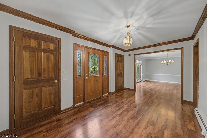 Spacious 4-bedroom, 3-bath custom home offering 3,543 sq ft of living space on a beautiful 1-acre corner lot in the highly desirable Succasunna section of Roxbury Township. This well-maintained home features generously sized rooms, a private library perfect for a home office or reading retreat, and a stunning primary suite overlooking the library below. The expansive basement offers endless possibilities for future living space, a recreation room, home gym, or media room. Enjoy outdoor entertaining on the patio, plenty of storage with the attached 2-car garage, and the privacy and curb appeal of a large corner property. Conveniently located near parks, shopping, dining, major commuting routes, and highly regarded Roxbury schools. A rare opportunity to own a distinctive home with space, character, and room to grow.