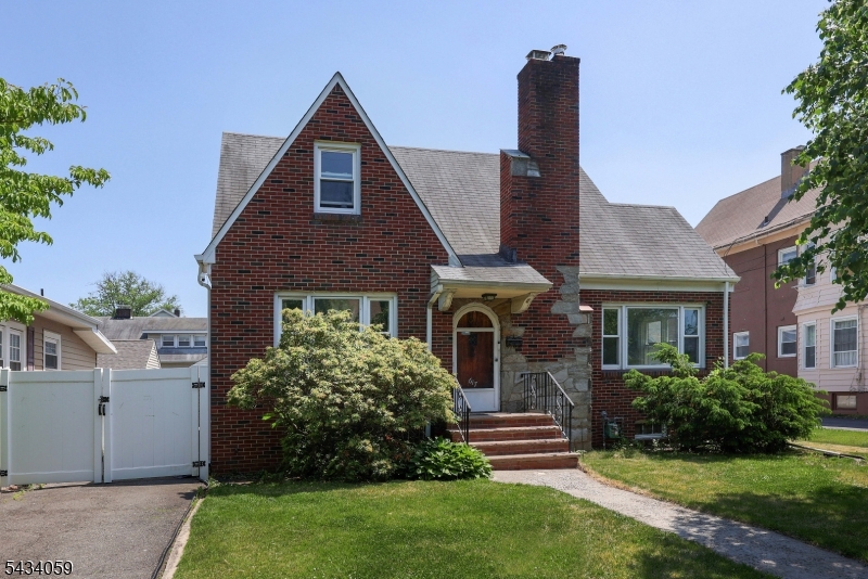 This charming 3-bedroom Tudor-style stone and brick home offers spacious rooms and timeless character throughout. Features include a large primary bedroom with a walk-in closet, hardwood floors, and an sun-drenched living room with a fireplace. The inviting kitchen showcases ample counter space, while the partially finished basement has been recently painted and includes the rough plumbing for a half bathroom. Additional highlights include newer windows, a detached 2-car garage, and full privacy fence with a generous yard.Ideally located in a quiet, picturesque neighborhood, the home is just blocks from the local grammar school, downtown shopping and dining, NYC-bound trains and buses, the Performing Arts Center, Hamilton Stage, and the YMCA. Enjoy quick access to major shopping malls, as well as nearby outdoor destinations including Milton Lake and Rahway Park.