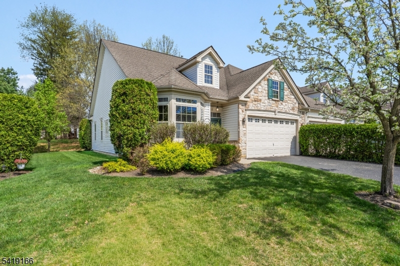 Welcome home ! FANTASTIC RANCH STYLE TOWNHOME LOCATED IN THE DESIREABLE DELAWARE CROSSINGS 55+ ADULT COMMUNITY. This wonderful home flooded with natural light consists of two bedrooms and two full baths.  The dining area overlooks the large living room.  The living room has a gas fireplace and sliders to access your private patio for you to sit and enjoy. Natural light bursts through the large windows throughout the home.  The Primary bedroom features tray ceiling, plenty of closet space and primary bath with a shower and a separate soaking tub. The second bedroom can be utilized as an office or den. The home  features a washer and dryer for your convenience. There is also a two car garage. Delaware Crossing Community offers an active lifestyle with amenities such as a clubhouse, heated pool, fitness center, sports courts, and bocce ball.   Located only minutes to Rte. 57 and 22.  There are medical facilities, shopping, and dining within minutes.