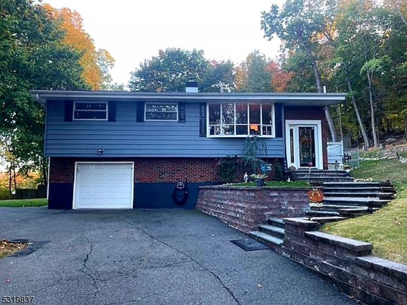 Lovely 3 bedroom, 2 and half bath updated with high end materials Raised Ranch, pride of ownership, nicely landscaped, $10,000 on new Italian flooring, stainless steel appliances, bright, natural lighting throughout, possible Mother/Daughter, delicately decorated in good taste, double sliders in kitchen lead to an amazing two tier deck, amazing for entertaining, Mountain Views, a special dog run for those furry friends, so much value in this home, new roof, downstairs can be a separate apartment.  An oasis away from the hustle and bustle of city life.  Close to restaurants, shopiing & all major routes 80, 46, 10 & 206.  You won't be disappointed.