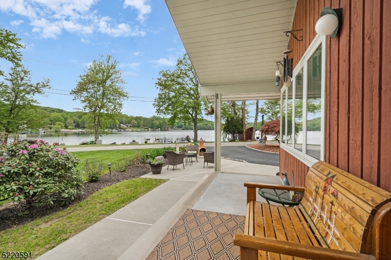 Situated on one of WML's most sought after streets with a rare cul-de-sac, this 3 bed, 3 bath ranch is a tranquil escape from it all. Spend your days at your private lakefront with a dock, beach, and ample lawn space for dining and entertaining. Living/dining room boasts lake-facing windows, hardwood floors, vaulted ceiling, and wood burning stove. Kitchen opens to the spacious great room and has new appliances and large pantry. Primary bedroom has large closets with the en-suite including a large soaking tub. Expansive floorplan of over 2200 sq ft also offers a family room in rear of the home with sliders to deck and fenced in yard. Plenty of storage in the attic and basement crawl space.  Newer roof, furnace and central air. WML also offers 2 pools, 6 tennis courts, athletic fields, clubhouse, lake access, playgrounds, year-round community events and easy access to Rt 80 and shopping.