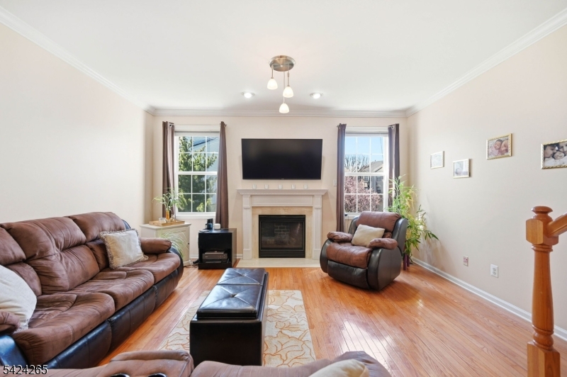 Located in sought-after Cambridge Heights at Nutley, this spacious townhome offers over 2,000 sq ft of sun-filled living space, 3.5 bathrooms, and a layout that stands out from similar models currently on the market with the addition of a rare FULL bathroom on the lower level ideal for guests, a home office, gym, media room, or flexible extended living. The KITCHEN RENOVATION (2020) features custom wood cabinetry, granite countertops, stainless steel appliances, center island, and a bright dining area. The open-concept living and dining spaces showcase soaring ceilings, recessed lighting, a gas fireplace, and UPGRADED FLOORING (2023) throughout much of the home. Upstairs, the primary suite offers oversized closets and an en-suite bath with soaking tub and separate shower, while the second bedroom is generously sized with nearby full bath access. The expansive lower level includes garage access, abundant storage, walkout access to a private patio, and an open backyard setting rarely found within the community. Additional highlights include NEW HVAC (2022), WATER HEATER (2024), NEW ROOF (2026), guest parking nearby, and access to Cambridge Heights amenities including pool, fitness center, tennis courts, clubhouse, and gated entry all conveniently located near NYC transportation, shopping, dining, and major highways.
