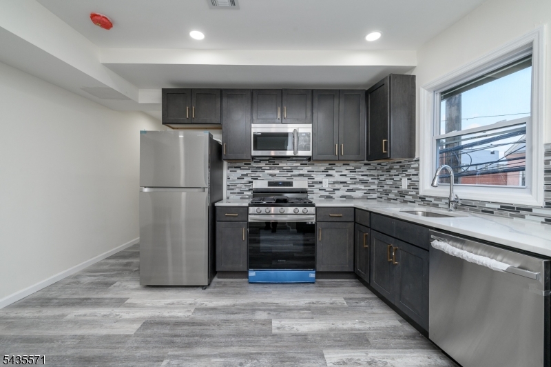 Experience beautifully remodeled Newark home! This stunning 3-bedroom, 2-bathroom unit has been fully renovated from top to bottom, offering modern comfort and ultimate convenience. This brand new kitchen is equipped with premium stainless steel appliances, modern upgrades, freshly finished, clean floors and an entirely new HVAC system for year-round comfort. Spacious living space with three generously sized bedrooms, including a private master suite with ample closet space. Nestled in a vibrant neighborhood, you are just minutes away from everything you need. This completely transformed apartment is absolutely an opportunity that you can't miss! Schedule your tour today!