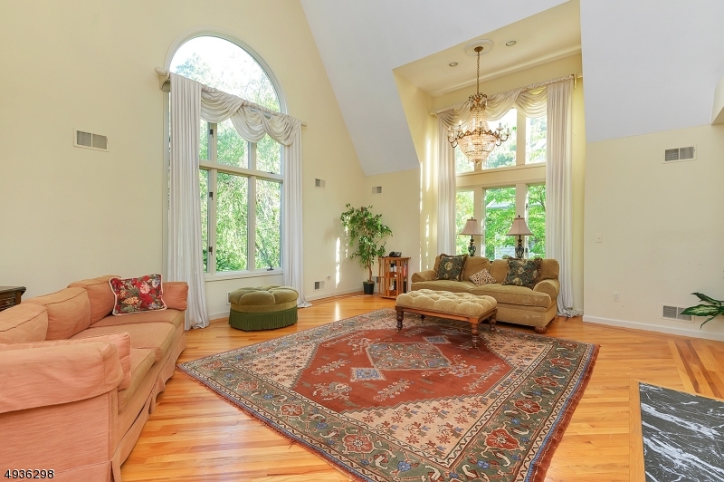 Spacious and custom built in 1990, this 4 bedroom, 3.5 bath colonial is situated on a desirable street within 1 mile to downtown Summit. Appr. 3,550 sq. ft per tax records. Great flow, generously sized rooms and high functionality. First floor features a welcoming entry foyer with powder room, living room with soaring ceiling/windows, large family room with built in cabinets, open kitchen with eat-in area, office space and walk-in pantry, formal dining room and bonus wet-bar area.  The second floor offers 4 bedrooms and three full baths.  Master bedroom has 2 walk in closets and large master bath.  Finished basement.  Recent updates include new roof 2024, newer appliances and new fencing in yard. Added features include hardwood floors throughout, laundry room on the first floor and a three car garage.  Walk or short drive to all schools.   Great opportunity to update and make it your own! Being sold strictly in "as is" condition. Buyer responsible to obtain Certificate of Occupancy.