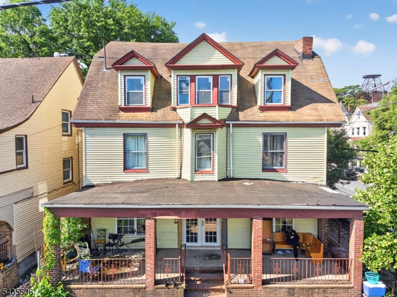 Welcome to this expansive legal 3-family property in the heart of Newark offering exceptional upside for investors, contractors, or owner-occupants seeking value-add potential. This spacious multi-family property features a total of 9 bedrooms and 3 full bathrooms across the main residential units, along with an additional finished basement space offering 4 bonus rooms, a full bathroom, a half bath, and a separate entrance providing flexible use potential.Featuring generously sized layouts, high ceilings, abundant natural light, and classic architectural character throughout, the property offers an excellent foundation for renovation. Situated on an oversized fenced-in lot with iron fence enclosure and gated entry, the property also includes a detached 2-car garage, separate utilities, and a large covered front porch adding to the home's curb appeal and presence. With over 6,300 sq ft of property area, this is a rare opportunity to reposition and customize a substantial multi-family asset in one of Newark's rapidly developing areas.Conveniently located near major transportation routes, shopping, schools, parks, and public transit with easy access to NYC commuting options. Property is vacant, requires a full cosmetic renovation, and is being sold strictly as-is. Buyer responsible for all municipal certificates, inspections, and due diligence. Excellent opportunity for investors seeking strong income potential, multi-generational living, or long-term appreciation upside.