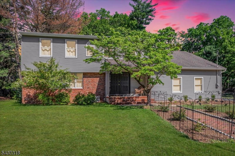 Welcome to this renovated Colonial nestled in the highly sought-after Arrowhead section of Edison. Situated on a picturesque, park-like 0.70-acre lot, this exceptional home offers over 3,000 sf of beautifully designed living space plus additional 330 sf of the finished basement blending timeless elegance with modern luxury. The thoughtfully designed floor plan features 5 spacious bedrooms and 3 full bathrooms, including a first-floor bedroom and full bath perfect for guests, or a private home office. Entertain with ease in the expansive formal dining room, ideal for hosting gatherings both large and small. At the heart of the home is a stunning chef's kitchen showcasing crisp white cabinetry, quartz countertops, and an impressive 10-foot waterfall island with seating for four. Premium Cafe appliances elevate the space, including an induction cooktop, double ovens, pot filler, built-in microwave, and a generous pantry closet, creating the perfect setting for everyday living and entertaining alike. With its extensive renovations, spacious layout, and desirable location, this move-in-ready home offers a rare opportunity to enjoy luxury living in one of Edison's most coveted neighborhoods. The second level is highlighted by a luxurious primary suite complete with a spa-inspired bathroom featuring smart mirrors, a heated towel rack, spa inspired smart toilet, soaking tub, and premium finishes designed for ultimate relaxation. 2nd floor laundry.