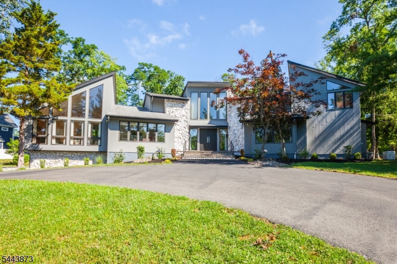 Welcome to this beautiful custom home being offered for the first time by the original owner. As you drive up the circular driveway, you'll enter pure elegance as the double entry doors open up to a light flooded home with marble floors, floor to ceiling windows and an open and flowing floor plan. Great room features a stunning fireplace with sculptured designed imported marble extending to the ceiling. Primary first floor bedroom offers an Italian marble circular jacuzzi, separate steam shower, 2 walk in closets, and dressing areas - as featured in Home and Garden magazine! There is a second en-suite first floor bedroom, an inviting large family room overlooking the overly large backyard and deck. Bright open kitchen, center island and all high end appliances with refrigerator & seperate freezer, two dishwashers, a dining area and a multi level dumb-waiter! Upstairs leads to a loft overlooking the great room allowing the light to flow around, with three en-suite bedrooms and a media/office space. Open stairway leads to basement with great room, wet bar, high ceilings,a safe room, art room,half bath and exercise room. Separate living quarters if needed with bedroom, full bath and window. This is all on a 1.17 acre lot, a very rare find in north Edison, with gate opening on the far end of the yard leading to another private entrance to Frost Ave.**********************OFFER ACCEPTED**********************