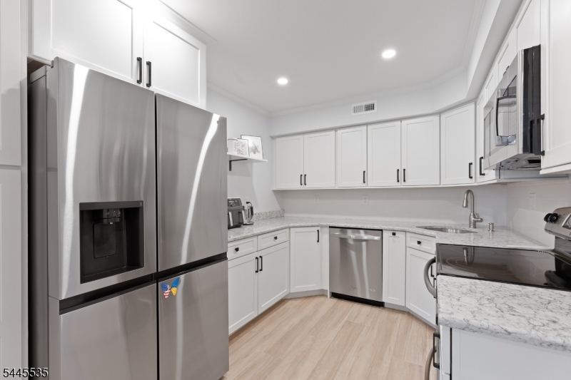 Welcome to this beautifully updated townhouse in the highly desirable gated community of Southwyck! This spacious home features 2 bedrooms, 2.5 bathrooms, and a large loft with skylights off the primary suite perfect for a home office, reading area, or guest space. The thoughtfully designed layout offers two main living levels plus the versatile third-floor loft.Extensively renovated in 2024, the home showcases new hardwood flooring throughout the first floor, new tile flooring in the kitchen and family room, updated and expanded kitchen, new LG refrigerator, new LG washer and dryer, recessed lighting throughout, stylish new light fixtures, new interior doors, new moldings and crown moldings, a new fire-rated garage door, and a new garage door opener with Bluetooth connectivity and a built-in camera. The entire interior has also been freshly painted, making this home truly move-in ready.Residents of Southwyck enjoy outstanding amenities including a clubhouse, community pool, tennis courts, and the security of a gated entrance. Conveniently located near shopping, restaurants, major highways, and public transportation, this home offers the perfect combination of comfort, style, and convenience.