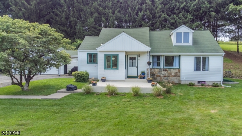 A GORGEOUS setting, on a hill overlooking the valley!  A tree-lined driveway leads to this updated Cape with inground pool.  Freshly painted kitchen with breakfast nook, light and bright living room/dining room with wood flooring and views from every window!  Two bedrooms plus den on 1st floor and huge bedroom on 2nd floor.  Other features include under eaves storage upstairs, new Trane furnace and updated central air, newer well pump and tank, newer water heater, pool recently resurfaced, new filter and pump in 2022. Old Farmers Road school district and West Morris Central High School with IB Program. Property is both Washington Twp, Morris Cty (Block 57/Lot 12.6 - 1.124 acres) and Tewksbury Twp, Hunterdon Cty (Block 4/Lot 10.1 2.02 - acres) for a total of 3.144 acres.*There is currently a handshake agreement between neighbors for neighbors to grow hay in front field*