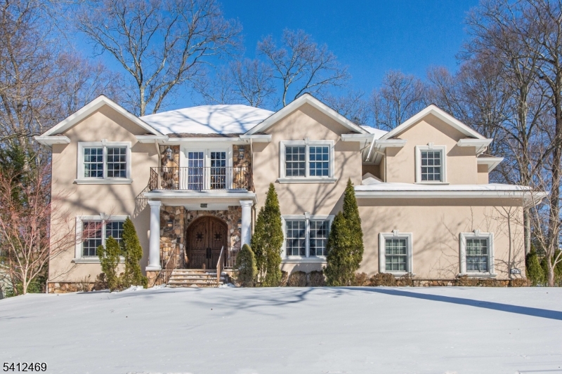 Welcome to this extraordinary custom home offering three impeccably finished levels of elevated living and exceptional craftsmanship. The multi-tiered backyard is a private retreat, featuring a stunning fieldstone pool with removable safety fence, an entertainment lounge with louvered pergola, and an upper sun patio complete with spa and full outdoor kitchen designed for unforgettable gatherings and serene relaxation. The open-concept main level seamlessly connects the family room with gas/wood-burning fireplace, casual dining area, private office, guest suite, and a chef's kitchen outfitted with premium Wolf and Sub-Zero appliances, including dual ovens, gas range with grill, refrigerator drawers, warming drawer, microwave, and two dishwashers. A wet bar and oversized pantry enhance both function and style. The expansive lower level boasts 13-foot tray ceilings with Italian stucco finish, a dramatic 28-foot granite-topped bar, kitchenette, full-size refrigerator, fireplace, game room, gym, and playroom an entertainer's dream. Upstairs offers five spacious bedrooms, a large laundry room (one washer, two dryers), a balcony overlooking the pool, and a luxurious primary suite with walk-in closet, changing room, jetted tub, and steam shower. Complete with smart-home technology, security system, generator transfer switch, irrigation, central vacuum, water treatment systems, and iAquaLink pool/spa controls, this home delivers refined comfort and modern convenience at every turn.