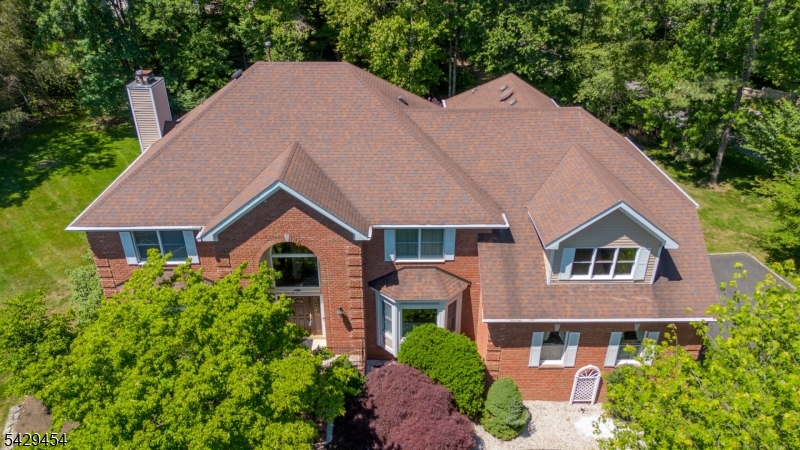 Welcome to resort-style living in the well sought-after Running Brook community of Bridgewater! Situated on a quiet cul-de-sac, this NE facing Center Hall Colonial home offers 5 bedrooms, 3.5 baths, and exceptional indoor and outdoor living on .47 acres. The spacious kitchen features abundant cabinet space, a large center island, breakfast area, and built-in office desk perfect for everyday living and entertaining. A first-floor ensuite bedroom with full bath and the oversized expansive primary suite on second floor includes office/sitting area for added comfort and flexibility. Enjoy the beautifully landscaped property with a deck and elegant brick-paved walkways surrounding the front and back of the home. The partially finished basement includes a media room and offers endless possibilities for additional living or recreation space. A newly painted 3-car garage with epoxy floors completes this exceptional property. Located in an excellent neighborhood with a peaceful atmosphere, this home truly has it all.