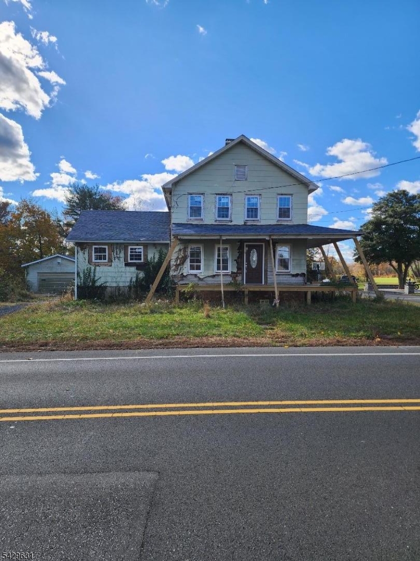 Introducing homeownership and investment opportunities at 899 Adelphia-Farmingdale Road a 3-bedroom, 2-bathroom single-family home set on over 1 acre in one of Monmouth County's most desirable locations. This property blends classic charm with the space and potential to become something truly special. Gutted and ready for finishing, featuring a new roof and windows and a wrap-around porch, the home invites creativity, personalization, and long-term vision. While the property does need work, it offers a solid structure, a spacious interior layout, and a picturesque lot, making it ideal for thoughtful renovations and lifestyle customization. Enjoy the privacy and flexibility of 1+ acres perfect for gardening, entertaining, or designing the backyard retreat of your dreams. Whether you're a homeowner ready to build equity or an investor looking for your next opportunity, this property delivers. Don't miss your chance to own in Freehold Township at a great value. Schedule your showing today and explore the potential of this amazing property. Use extreme caution when entering.