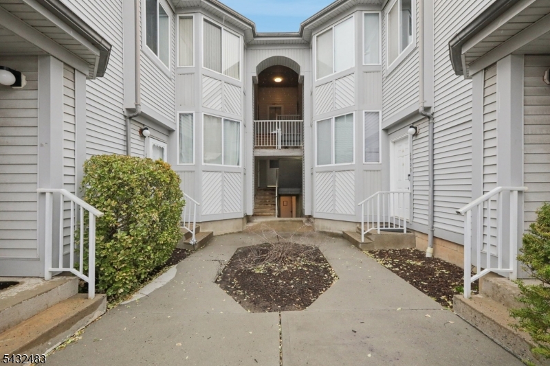 Welcome to this beautifully maintained luxury 2-bedroom, 2-bath condo in the desirable Commons community of Piscataway. This luxury unit is move-in ready which features updated hardwood flooring throughout, a spacious primary suite with full bath and generous closet space, and an updated eat-in kitchen with stainless steel appliances and modern countertops. The bright living room offers a cozy wood-burning fireplace and access to a private deck, perfect for relaxing or entertaining. For added convenience there is a laundry facility in unit. The home includes a first-floor attached 2-car garage with extra storage and convenient direct entry into the unit.