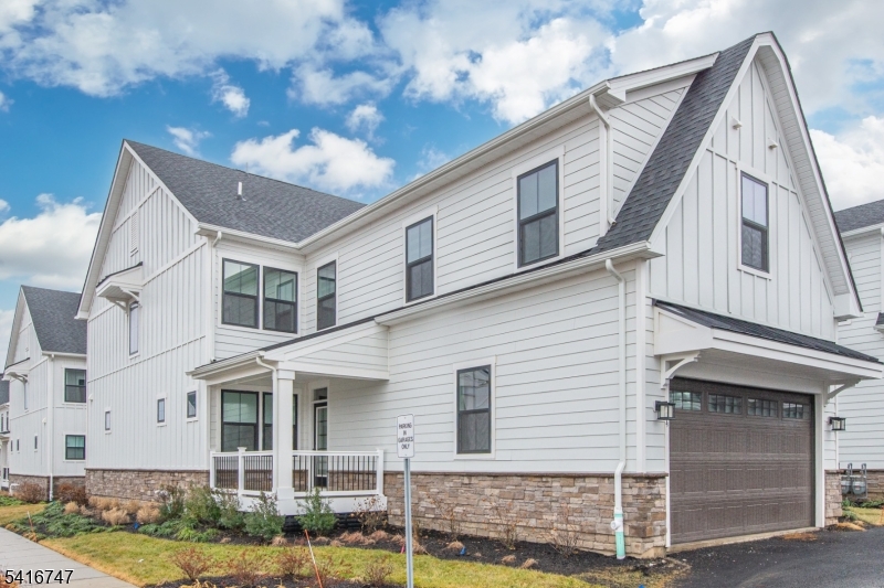 Welcome to PARQ, an upscale community with modern details in the heart of Parsippany. Ideally situated, this stunning Rockefeller w Library model home offers state of the art design with loads of builder upgrades, is just minutes from Routes 287 & 80. The main level features rich floors & a bright, open layout designed for both everyday living & entertaining and many upgrades. A formal dining room provides the perfect setting for gatherings or could be another living area. The living room flows seamlessly into the gourmet chef's kitchen, beautifully appointed with quartz countertops, a spacious center island, high-end appliances, & a sunny breakfast area. A private first-floor office offers flexibility & can easily serve as a guest room. Upstairs, the primary suite offers a peaceful retreat w 2 spacious custom walk-in closets & a spa-inspired bath featuring dual vanities, a freestanding soaking tub, & shower. Two additional bedrooms w their own custom walk-in closets & private en-suite baths, while a loft provides space for a second office, play area or cozy spot to read. Custom blinds throughout the home add both convenience & a sophisticated designer touch. A finished basement w high ceilings adds another level of living space, ideal for a rec room, gym, or media lounge, along w generous storage. Enjoy outdoor living on the private deck, as well as the convenience of a two-car garage with mudroom entry.