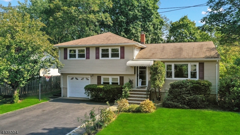 Beautiful 3 bedroom, 3 full bath split level home on quiet cul-de-sac.  First floor offers living room with picture window, dining room overlooking the private backyard, eat in kitchen with stainless steel dishwasher & gas range,  Second floor offers spacious master bedroom with private bath, 2 additional bedrooms & updated main bath.  The lower level features a family room, mudroom, laundry, a full bath & a 3 season porch with access to the outside.  Gleaming hardwood floors thru out, freshly painted, updated main bath & lower bath, gorgeous level lot, quiet neighborhood, but close to everything!  Don't miss this one!