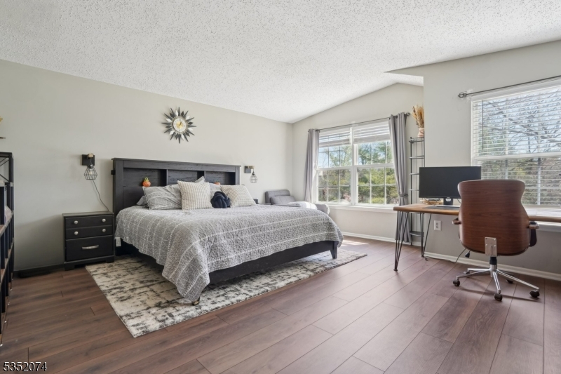 Welcome to this highly sought-after, 3 bedroom, 2.5 bath townhome in the desirable Rose Arbor community. As one of the complex's largest units with over 1,700 sq ft of living space, a 1-car garage, and abundant additional parking, this home offers both space and practicality. A covered entryway leads you up a set of stairs to the inviting main level, featuring a spacious living area with impressive 9-foot ceilings, a dedicated dining space, well-equipped kitchen, and powder room. On the top floor, you'll find three generously sized bedrooms plus a versatile bonus room - perfect for a home office, gym, playroom, or extra storage. The oversized primary suite impresses with vaulted ceilings, two expansive walk-in closets, and a luxurious ensuite bathroom complete with a shower and soaking tub. Laundry is conveniently located on the upper level for ease of use. All public utilities are in place, ready for you to move in and make it your own! Ideally located just minutes from Morristown Green, NJ Transit, and major highways, convenience is at your doorstep.