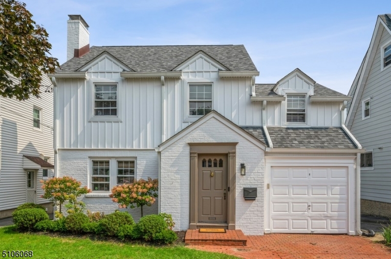 Absolutely charming, modern home in the ideal location! Beautifully updated Colonial with three bedrooms, one and a half bathrooms, and a one-car garage sits on a manicured lot on a quiet, dead-end street. Just a few doors down from the idyllic 121-acre Brookdale Park, this home is located close to shopping, dining, schools, and NJ Transit's Midtown Direct train line for an easy commute to Penn Station. Updated to perfection, this home features beautiful hardwood floors, bright, open rooms with space for entertaining, central air and all the conveniences of modern everyday living. An inviting brick paver driveway and entry lead you inside to a vestibule with a coat closet opening to a sun-washed living room with a wood-burning fireplace and a spacious formal dining room. The stylish and sunny eat-in kitchen is equipped with quartz counters, stainless steel appliances, a breakfast bar, and side-by-side windows letting in lots of natural light. Off the kitchen is a half bathroom and access to a private, fenced-in outdoor sanctuary complete with a deck and plenty of room for outdoor dining, gardening, and relaxing. On the second floor is a large primary bedroom with three deep closets, two additional bedrooms, and a remodeled marble hallway bathroom with a soaking tub, floor heating and separate glass shower. The partially finished basement with high ceilings offers a laundry area, storage, and great potential for expanding your living space.