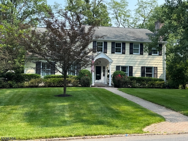 Step into this fabulous sun-filled 5BR Colonial perfectly located in the heart of Summit's Franklin School district just steps to Franklin Elementary School.  This home ticks all the boxes - an inviting foyer is flanked by a large living room w/gas FP & a must have first floor office w/adjacent powder rm & coat closet (possible 1st floor BR option).  A formal dining room is ready for holiday entertaining as is the updated gourmet kitchen w/a large center island, tons of cabinets, & SS appliances.  A renovation/expansion to the home includes a large breakfast room and family room addition w/high ceilings overlooking an expansive patio & backyard.  Enjoy the convenience of direct entry from an oversized 2 1/2 car garage entering to the mud room & second powder room.  On second are 4BRs & 2BAs including a LUXE primary suite with WIC.  A 5th BR, Full BA & walk-in attic storage complete the 3rd level.  The lower level offers a great recreation room, exercise area, laundry, storage/utility space all with high ceilings.  Whole house generator included.  Set on a private, level lot with quick access to schools, town and NYC transportation, this turnkey home is a fabulous opportunity!  Fireplaces, chimneys, flues to be purchased in as is condition.  Note: July 31, 2025 occupancy preferred. FOR COMP PURPOSES ONLY