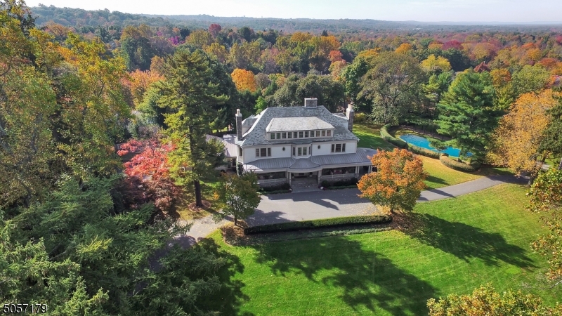 The earliest of three Rossiter & Wright-designed estates, Finisterre set the tone for many other fine Summit residences. A structurally significant Colonial Revival built in 1892 and fully renovated to perfection in 2004, this residence has been extensively redesigned and expanded for today's modern lifestyle with no expenses spared during its restoration. The beauty of this magnificent estate, ideally situated on the largest residential neighborhood property in Summit, lies in its balance of refined architectural detailing, unsurpassed craftsmanship and grand open spaces, boasting 20 rooms including 9 bedrooms, 6.2 baths and 5 fireplaces. The grounds feature sweeping lawns, an expansive circular drive, 3-car garage, heated in-ground pool with pool house and wrap-around front porch. Truly spectacular.