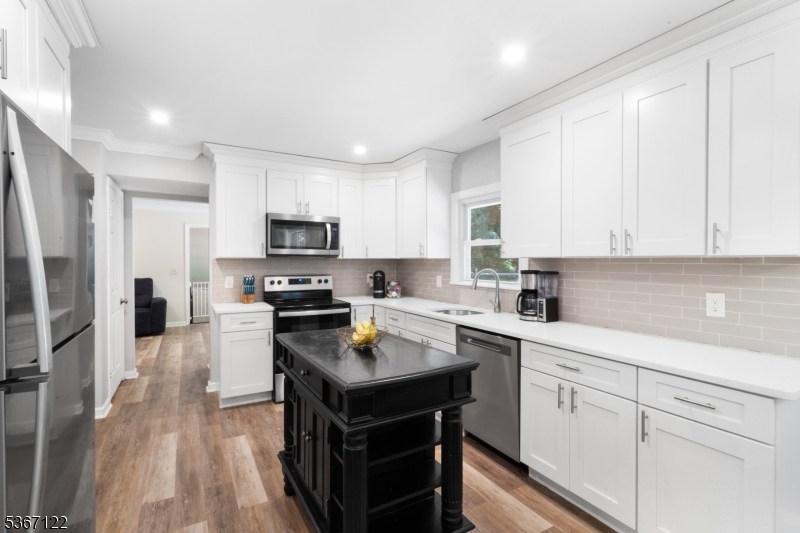 Beautiful and private Colonial home set on over 4 acres in a peaceful, tranquil setting, offering nearly 2,000 sq ft of living space (not including the expansive basement).  NEW roof in June of 2025. Powder Room upgraded with new vanity & flooring in 2024. Fully renovated in 2023, this move-in-ready home blends timeless charm with modern updates throughout. Renovations include a brand new kitchen, new bathrooms, new siding, new windows, new flooring, a newly paved driveway and walkway, new fencing, and more. The septic system was replaced in 2021. Enjoy peaceful mornings on the inviting lemonade porch and take advantage of the land that extends well beyond the fenced-in area perfect for hiking, exploring, or future possibilities. Inside, you'll find a spacious primary suite with a walk-in closet and updated en-suite bath, plus generous living and bedroom spaces throughout. The full basement offers endless possibilities for storage, a gym, workshop, or recreational space. Additional highlights include an attached garage with both interior and exterior access. Conveniently located just 4 minutes from Route 46, 10 minutes to downtown Hackettstown, 15 minutes to Panther Valley, and 20 minutes from East Stroudsburg. A rare opportunity for space, privacy, and modern comforts don't miss it!