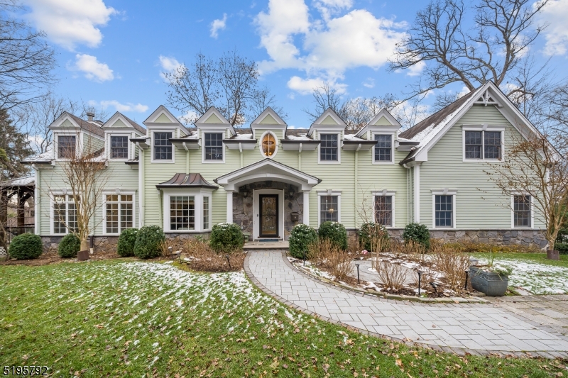 Built new construction 2004. Sophistication meets style and utmost privacy in the sought-after Old Country Club section of Ridgewood. Immaculately designed with every modern amenity and 9-foot ceilings throughout, and a secluded backyard oasis featuring a trendy porch and heated gunite pool & spa. Extensive main level with an open concept at the heart of the home featuring a (2019) Peter Salerno eat-in kitchen with a marble center island and Wolf and Subzero appliances, a casual dining area, and an 11-ft ceiling great room with fireplace. Convenient 1st-floor bedroom, full bath, formal living room with coffered ceiling, and dining room wraps up the 1st level. Upstairs, find an impressive primary suite with a walk-in closet, and stunningly upgraded spa-like bath, 2 bedrooms with jack & jill bath, another bedroom, and full bath. Large finished basement offers a full bath, game room, bar, and attached 3-car garage. Prime Highland Ave location near schools, train & bus to NYC & more!