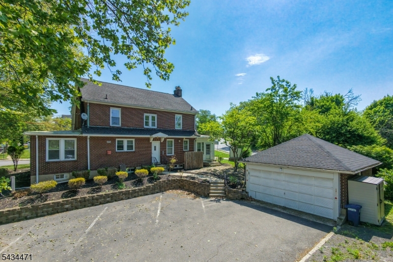 Handsome, all brick occupied through years as combo office/ residence.  Excellent hardwood floors throughout. Heated Sunparlor with private entry.  Price reflects need for buyer to install a kitchen to suit.  Both full bathrooms in very good condition.  3 basement rooms finished. Updated utility systems. While located facing highway, this solid built home is quiet when inside and an outstanding example of quality construction .    There is NO KITCHEN in place, just an empty room