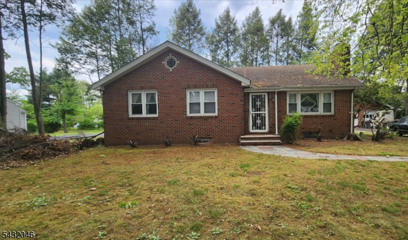 MAKE THIS HOUSE YOUR OWN DESIGNED HOME! This is an all brick ranch style home on a nice level lot. The property needs TLC and is being SOLD AS IS. It has a spacious eat in kitchen, living room, 3 bedrooms and a full bath on the main level. The basement could be a nice recreational flex space, it's partially finished with a laundry room and 3/4 bathroom. The boiler and hot water tank have been recently installed. There is a decomissioned oil tank underground. There is a 2 car garage along with a long driveway that can allow for several more vehicles. FHA 203k/renovation loans, cash loans preferred, due to condition of the property. Seller will not make any repairs. Buyers are responsible for township inspection certificates.