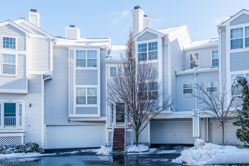 Beautifully renovated and maintained townhouse in Oak Ridge. Freshly painted and Hardwood floors throughout. Updated eat-in kitchen with S/S appliances, tile backsplash, granite counters, 42" cabinets & more. Enjoy the open Living & Dining room w/ gas fireplace with vaulted ceilings & huge windows. The walkout lower level is finished & perfect for playroom, exercise room, rec room or office with plenty of additional storage. 2nd floor features a master suite with walk-in closet, stall shower, jetted tub & double sink vanity. There is also a second bedroom, full bath and loft that be used as den or sitting area. All updated bathrooms. New skylights and roof installed in 2018. Low taxes. Community offers pool & tennis court. Easy commuting, NYC Trains/Buses, major highways, shopping and recreation.