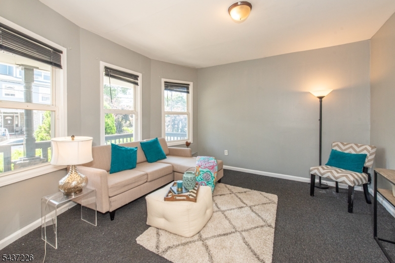 PRIME VAILSBURG LOCATION! 4-bed, 2-bath Newark single-family new to market. Sunny 1st flr delights w/ living room & dining room combo w/ bay style window, 1 big bedroom (currently used as formal dining room), renovated full bath, modern eat-in kitchen w/ stainless appliances (w/ brand new fridge), quartz countertop, plentiful cabinetry & breakfast nook (currently office) w/ washer/dryer hook up. 2nd flr features 3 bright bedrooms & remodeled second full bath. Home boasts charming front lemonade porch, private backyard ideal summer grilling, sizable unfinished basement w/ storage galore - or finish it for home office/play space/gym. Hardwood floors, high ceilings, elegant turn of the century molding, updated plumbing & electrics thru-out, ample street parking & fenced yard. Near Vailsburg Park, Seton Hall University, shops/eateries on South Orange Avenue & Springfield Ave, Lincoln Elementary School, Garden State Parkway, I-280 & Newark Liberty Airport make this a commuter's dream!