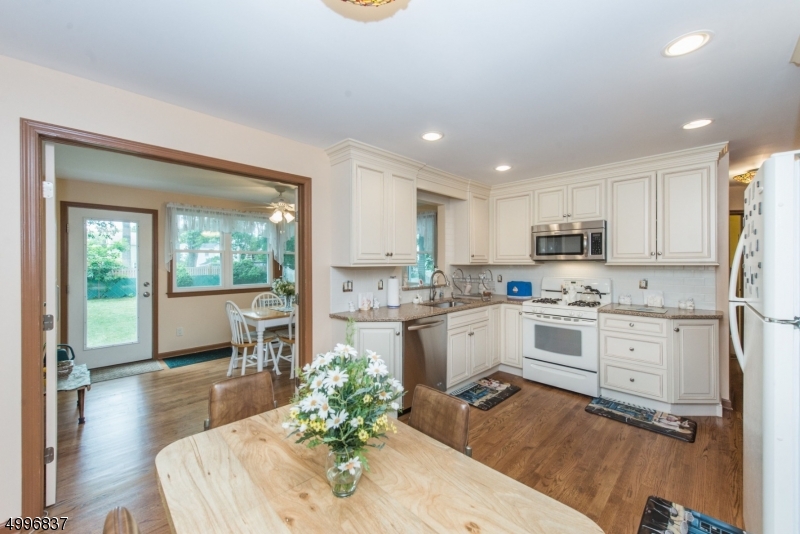 Fantastic location living in Oakview.  Updated Cape beautiful kitchen  granite counter tops ss undermount kitchen sink backsplash with subway tiles. Hardwood floors finished basement Quiet Street. New furnace and water heater.