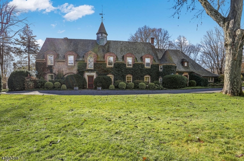 This stunning brick manor home was totally renovated by interior designer owner in 2005 is a blend of English and French Normandy styles. Designed by renowned architects Peabody, Wilson, and Brown. The grounds of Glynden on 5 acres include a pond, pool, courtyard, stalls, glorious gardens, specimen trees and a 3 car garage.Located in the Silver Lake Historic District, an elite neighborhood with rolling lawns and vintage estates which go back as far as the American Revolution.The home  was originally built as a part of "Tyvan Hill", the 10,000 sq ft stone country mansion which will be 2020  Mansion in May Designer Showhouse. Stunning Chef's kitchen addition with superb custom cabinetry,granite,soaring ceilings and windows. Oversized Master Bedrm. with Spa like bath.2nd flr. rec/media/exercise rm.