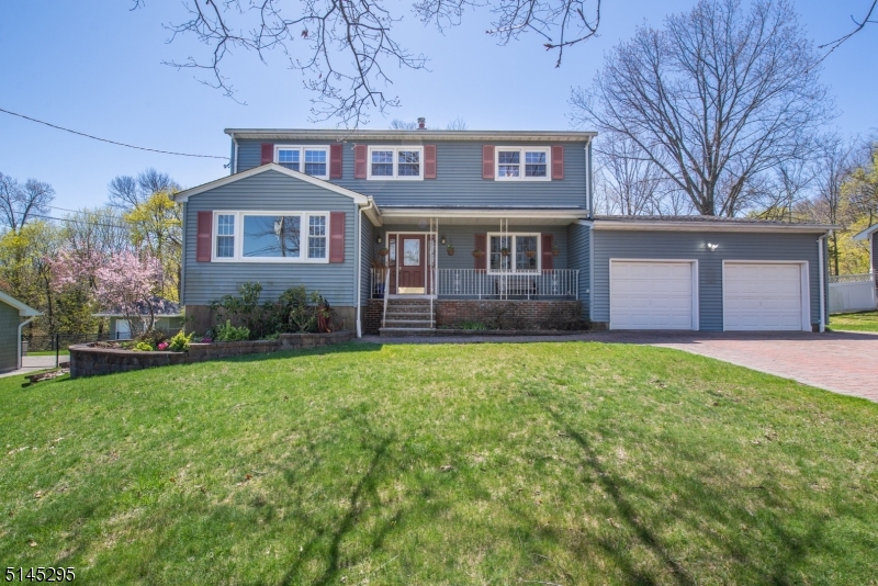 Gorgeous Center Hall Colonial w/ Inviting Lemonade Front Porch. Located in the heart of Wayne, on a quiet, tree-lined street by Preakness Hills Golf Course. This 2,200 sq ft Country Home has a Comfortable, Spacious Floor Plan. Many Appealing Features Throughout. Large Living Room and Den Bookend the Welcoming Foyer & Center Stair. French doors, wainscoting & hardwood throughout! Bright, Eat in Kitchen- tons of cabinet & counter space. Formal dining room. Convenient laundry. Upstairs, the Master Suite w/Walk-in Closet & Bath +3 Additional BDRMS & Full Bath. Ideal Layout. Super-sized BSMT hosts a Family Room & Plenty of Storage space. 2 Car Garage. Paver Block Driveway fits 6. Beautiful backyard oasis with trex deck, in ground pool & lawn. Truly a Staycation! Completely fenced in. Perfect for Entertaining & Relaxation! It will be Easy to Fall in Love w/this Home. Great schools! Easy access to major highways.