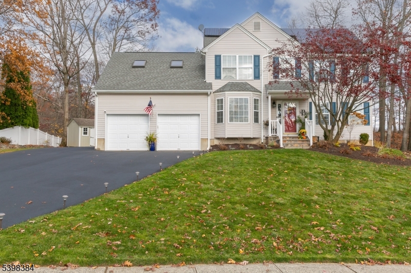 Stunningly updated & meticulously maintained, this 3/4 bedroom,(upstairs great room currently used as bedrm),3.5 bath home offers the perfect blend of modern upgrades & warm, inviting living spaces. Step inside to find newly refinished hardwood floors, fresh paint, updated lighting, crown molding & an open, sun-filled layout ideal for both everyday living & entertaining.The beautifully remodeled kitchen features white cabinetry, granite counters, stainless steel appliances, subway tile backsplash, & a breakfast area surrounded by windows overlooking the backyard. The spacious family room offers recessed lighting, large windows, & seamless access to the expansive, multi-tiered deck complete w/a covered gazebo & outdoor hot tub for year-round enjoyment. Upstairs, the primary suite includes a walk-in closet & en-suite bath, while two additional bedrooms share another full bath. A large finished third-floor bonus room provides incredible flexibility for a guest suite, office, or recreation space. The fully finished basement adds even more living space w/a full bath, recreation room, office area, & additional storage space. Outside, enjoy privacy, w/mature trees, new landscaping, a shed for storage, & an oversized driveway w/extra parking! Property features in-ground irrigation & solar panel systems. New A/C & Furnace were installed this year. Absolutely move-in ready w/updates throughout this is the home you've been waiting for! Perfection is here for you today!