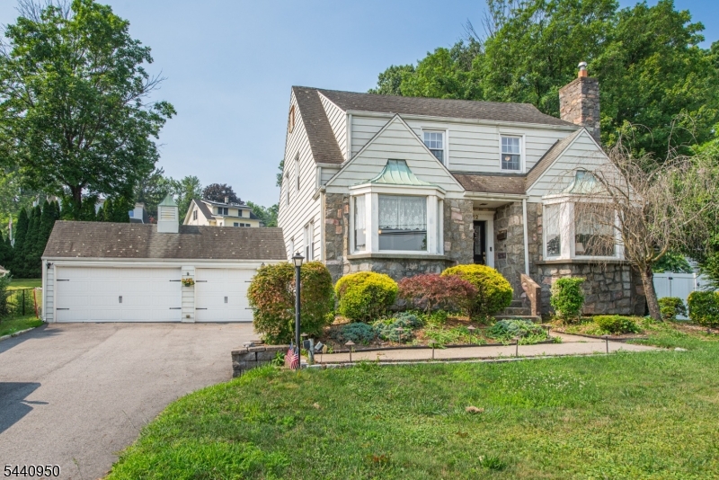 Stunning Colonial Blend: Historic Charm Meets Modern Luxury. Welcome home to this beautifully updated Colonial, where classic architectural character blends seamlessly with brand-new modern comforts. The main level welcomes you with gleaming hardwood floors throughout. Host unforgettable gatherings in the formal dining room, complete with traditional built-in cabinets, or relax by the cozy fireplace in the spacious living room. A bright family room and a versatile sunroom offer endless options for a home office, playroom, or relaxation space. The gourmet kitchen features a center island, granite countertops, and stainless-steel appliances. Upstairs, the expansive primary bedroom suite serves as a private retreat, featuring two walk-in closets and direct stair access to a large, floored attic perfect for easy-access storage or future finishing. The lower level boasts a fully finished recreation room, fresh flooring, and a dedicated laundry area with washer and dryer. Peace of mind is built-in with a French drain system and sump pump. Outside, enjoy an over-sized garage that leads to a functional mudroom. Your private backyard oasis features a spacious patio and a perfectly situated above-ground pool overlooking the lawn. Located in a highly desirable neighborhood, you can walk to town, local shopping, and ball fields, while enjoying quick commuter access to major highways and the train station.