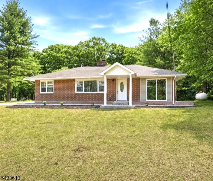 Welcome to your own private sanctuary in Wantage! Situated on over 2 breathtaking acres of secluded property, this beautifully renovated ranch offers the perfect combination of modern upgrades, peaceful surroundings, and endless potential. This home features 2 bedrooms and a stunning brand-new full bathroom, along with a completely renovated kitchen showcasing stylish finishes and modern conveniences. Every detail has been thoughtfully updated to create a warm and inviting living space. A standout feature of this property is the brand-new 4-BEDROOM SEPTIC SYSTEM a significant upgrade that not only provides peace of mind but also offers tremendous value and future flexibility that is rarely found in a 2-bedroom home. Additional major improvements include new central A/C, new 200-amp electrical service, and a brand-new hot water heater, making this home truly move-in ready. Outside, you'll find an impressive oversized 2-car detached garage with additional storage space, all enhanced with a new roof, new flooring, new doors, and brand-new electrical service perfect for vehicles, equipment, hobbies, or a workshop. What truly sets this property apart is the perfect combination of thoughtful renovations and a spectacular setting, nestled on over 2 private acres that offer exceptional privacy, beautiful natural surroundings, and a peaceful atmosphere that is increasingly difficult to find.