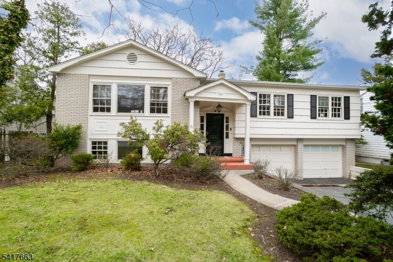 Welcome to this spacious and versatile 4-bedroom, 3-full bath home located on a quiet residential street in the highly desirable community of West Orange. Perfectly designed for today's flexible living needs, the home offers a unique mother/daughter style layout with separate living areas.  The main level features bright, open living and dining spaces with beautiful hardwood floors and large windows that fill the home with natural light. The eat-in kitchen offers generous cabinet space and overlooks the backyard, making it a great opportunity for a new owner to update and design their dream kitchen.  Upstairs, three well-proportioned bedrooms include a spacious primary suite with its own private bath, along with an additional full hall bathroom. The lower level offers a fourth bedroom with brand new wall-to-wall carpeting, a full bathroom, and a separate living area, creating an ideal setup for a mother/daughter configuration or private guest suite. The home also features a large family room downstairs with sliding glass doors leading to the backyard, providing easy indoor-outdoor living and access to the elevated deck overlooking the property.  Additional highlights include a two-car garage, ample storage, and a flexible floor plan.  Conveniently located near parks, schools, shopping, dining, and major highways, this home offers easy access to NYC transportation while enjoying the charm and convenience of West Orange living.  Home being sold strictly "AS-IS"