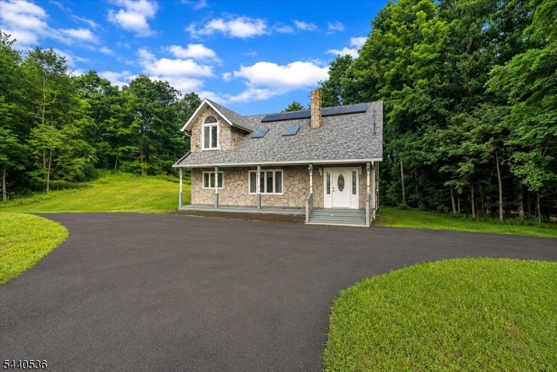 Welcome to this charming and well-maintained home offering 3 bedrooms and 2 full bathrooms, thoughtfully designed for comfortable everyday living. Beautiful hardwood flooring flows throughout the home, creating a warm and inviting atmosphere.The main level features a spacious living room highlighted by a stunning stone fireplace and wood stove, perfect for cozy evenings. The updated kitchen is equipped with recessed lighting, white shaker-style cabinetry, stainless steel appliances, and a convenient breakfast bar, making it ideal for both meal preparation and casual dining. Also located on the first floor are a formal dining room, laundry room, foyer, powder room, and a versatile bonus room that can be used as a home office, playroom, or additional living space.Upstairs, you'll find three comfortable bedrooms, each featuring ceiling fans for added comfort, along with a full bathroom. The unfinished basement provides ample storage space and future potential.Step outside to enjoy the deck, offering the perfect setting for outdoor dining, entertaining, or simply relaxing. Conveniently located near schools, transportation, parks, recreation, and shopping, this home combines comfort, functionality, and an excellent location. Don't miss the opportunity to make it yours!