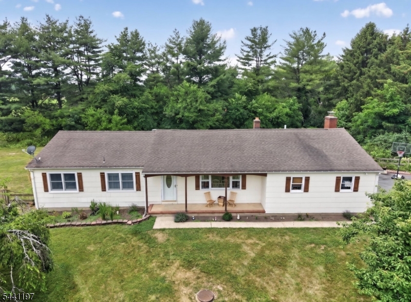 Welcome to this beautifully maintained ranch in the highly desirable East Amwell Township, offering the perfect blend of comfort, space, and convenience. This home features 3 bedrooms, 2  bathrooms, a spacious family room, kitchen and formal dining room, providing plenty of room for everyday living and entertaining. The family room has a cozy wood-burning fireplace with sliding glass doors that lead to a large rear deck perfect for gatherings or just relaxing. The primary suite has its own a private bath for added convenience. Two additional bedrooms and a spacious full bath for guests and your own needs. A full basement with high ceilings offers tremendous potential for future finishing and expansion, while the laundry area is conveniently located in a separate section of the basement. Additional amenities include a two-car attached garage with interior access, charming rocking-chair front porch, and a patio off of the deck As an added bonus, this home is conveniently close to schools, shopping, and commuter routes.Don't miss this exceptional opportunity to own a spacious and well-appointed home in one of East Amwell's most desirable locations.