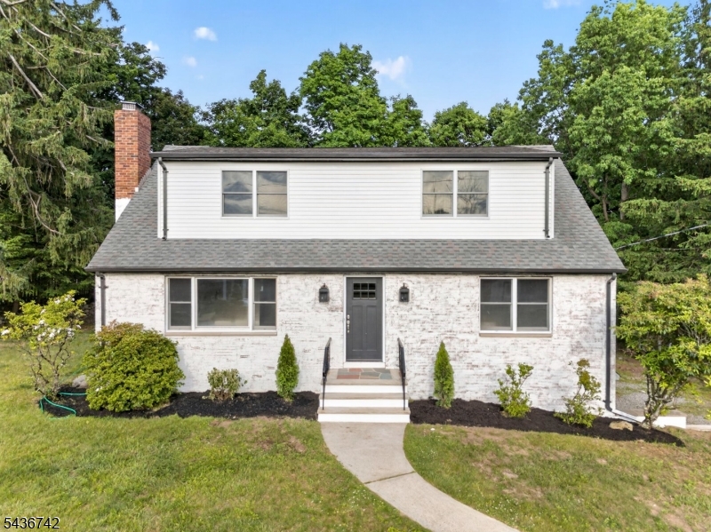 Beautifully renovated 5 bedroom, 3 full bath home located in one of Mahwah's most sought-after neighborhoods. This spacious residence seamlessly blends modern updates with timeless character, featuring an open concept layout, gleaming hardwood floors, and a cozy wood burning fireplace. A substantial second floor addition has significantly expanded the home's living space, offering three generously sized bedrooms, including a large full bath and stunning primary suite. Much larger than it appears from the exterior, this home offers an impressive layout and square footage that must be seen to be appreciated. Buyers are encouraged to perform their own due diligence regarding square footage, as tax records may not reflect the home's expanded living area. The finished basement with sleek tile flooring provides additional flexible space, perfect for recreation, a home office, or gym. Enjoy the convenience of a two-car garage, expansive driveway, brand-new mini-split systems, central air, and a new well water system. The freshly painted exterior enhances the home's curb appeal, while its prime location offers easy access to NYC transportation, major highways, shopping, dining, and outdoor recreation. A truly move in ready opportunity in Mahwah. Driveway BLACKTOP WILL BE COMPLETED AT CLOSING!