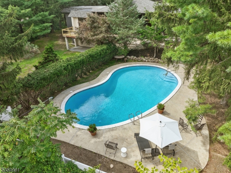Luxury living at its finest with your own in-house spa! So many amenities: heated Gunite outdoor pool, inside sauna for two, media room and a huge entertainment area complete with built in full size wet bar and fridge, fireplace, with walk out to the backyard. This property is at the end of a quiet dead-end road offering privacy and quiet. Enjoy multiple outdoor patios and large outdoor deck surrounded in your private backyard. This modern 5 bed/4 bath custom home has been completely renovated with all new 2 zone HVAC, plumbing, water heater and new roof. The stunning gourmet kitchen features new cabinetry, center island, new SS monogram appliances, wine fridge, built in micro and quartz counters that opens up to the large family room. All four bathrooms feature new tile, designer vanities and fixtures. The primary suite opens to its own stone patio.with pool views. Gorgeous stone walls, fireplace, floor to ceiling windows are some of the features that make this home truly special. This is a one-of-a-kind home!