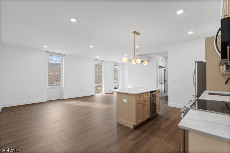 Discover this stunning 2-bedroom, 1-bathroom condo nestled in one of Newark's newest boutique condominium developments, perfectly positioned along the iconic Lincoln Park. Offered at $495,000, this move-in ready residence blends contemporary finishes with everyday comfort in one of New Jersey's most connected urban neighborhoods. Step inside to find an open, light-filled layout designed for modern living. The unit features central air conditioning and in-unit laundry for effortless convenience, while sleek finishes throughout make this home as stylish as it is functional. Commuters will love the unbeatable location just minutes from Newark Penn Station with direct PATH train access to Manhattan, and only a short drive to Newark Liberty International Airport. Whether you're heading into the city for work or catching a flight, you're always right where you need to be. Beyond your front door, Lincoln Park offers a beautiful green escape in the heart of downtown, with dining, shopping, and entertainment just steps away. This is a rare opportunity to own in one of Newark's most exciting new developments. Don't miss your chance to call 21 Lincoln Park home.