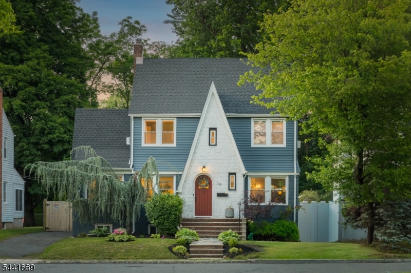 FIRST-TIME HOME BUYER DREAMS COME TRUE IN CHARMING MOVE-IN READY HOME! Cottage-core curb appeal is only the beginning of the attraction of 19 Buckingham. Inside you'll be dazzled not only by the incredible natural light & timeless details like archways, oak doors w/ glass knobs & original hardwood floors throughout but also by the ingenious use of space & thoughtful design upgrades that create a truly turnkey 5 Bed/3.1 Bath 4-level home. Living Room is the heart of the home w/ gas fireplace & built-ins, next to Family Room w/ tons of windows & Full Bath/Laundry attached, perfect for double duty as a guest room! Spacious Dining Room is a kaleidoscope of colors, w/ morning light streaming through original stained-glass window. Eat-in Kitchen maximizes space w/ breakfast bar, amazing wall of cabinets & SS appliances. 2nd Level features Insta-worthy Bathroom w/ radiant-heat floor & modern soaking tub w/ rain showerhead. Primary Bedroom has 2 walk-in closets & windows on 2 exposures. 2 additional Bedrooms complete the 2nd floor. The 3rd Floor features 2 more Bedrooms plus a Full Bath, an ideal setting for home offices or a guest suite. Lower Level has 2nd Laundry Room, Half Bath, Rec Room & lots of storage space. Charm continues in fenced-in backyard w/ patio, flat grass play area, shade trees & 2-car Garage. Great  neighborhood w/ playground up the street. Jitney to NYC train is steps from the front door! Minutes from parks, Zoo, shops & services. New roof + many more upgrades!