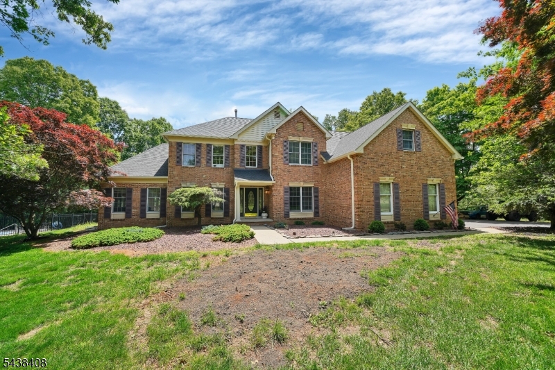 Nestled on a private 3.9-acre flag lot within a desirable neighborhood setting, this stunning 4-bedroom, 3 full and 1 half bath brick-front Colonial offers the perfect blend of privacy and community. Enjoy breathtaking valley views from the backyard oasis featuring an in-ground pool with a newer liner, ideal for relaxing or entertaining. Inside, brand-new carpeting enhances the living room, dining room, family room, and bright, airy conservatory on the main level. The updated kitchen boasts stainless steel appliances and opens seamlessly to the impressive two-story family room, creating an inviting space for everyday living and gatherings. Upstairs, the spacious primary suite features a private sitting area and full bath, while three additional bedrooms and a full hall bath provide ample space. The finished lower level expands the home's versatility with a large recreation room, full bathroom, private office, and exercise room offering plenty of space for work, fitness, and entertainment. A rare opportunity to enjoy peaceful country-style living with neighborhood convenience, this exceptional home truly offers the best of both worlds. Located in Long Valley, with top rated schools. Do not pass this one up!