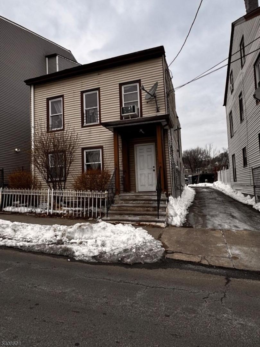 Welcome home to your huge double lot with lot 15 driveway and extremely deep lot great potential. Close to major highways and parking near New Development, NYC Transit, shopping and houses of worship. No flood insurance required. Both 2 bed 1 bath units currently occupied. Please do not walk on lot. Huge opportunity for investors in need of parking.
