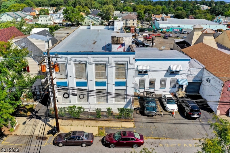 Turn of the century 17,360 square foot building in the Forrest Hill section of Newark with very easy access to McCarter Highway route 21.  Three floors total; 1st floor 6380 sqft, 2nd floor 6090 sqft, 3rd floor 4890 sqft, plus roof top.  Inside you'll find a loading dock servicing the 1st /2nd floor and then fork lift access through back of building.  Service elevator in back of building (not working as is).  Abundant amount of electric: 240v, 3 phase, split service to each rentable floor/ unit.  Very high ceilings on each of the floors.  Drive in garage.  Office area, conference room, and kitchenette lounge area with 2 balconies  overlooking back of building. One rollup door garage in front and 1 drive in garage on lower basement level.  Updated HVAC system.   Currently occupied by Technology Company paying $15000 per month plus taxes and cam and may sign long lease.