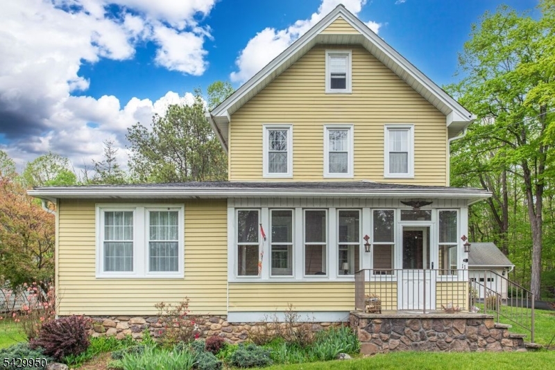 Welcome to 11 Oak Rd, a charming Colonial offering comfort and functionality. The first floor features a kitchen w/ pantry overlooking the level yard, a living room, formal dining room w/ walk out to deck, generous sized family room filled with light, crown moldings, convenient laundry area and a sweet enclosed 3 season porch complete with a swing.  The second floor offers 2 bedrooms, walk in closet and a full bath. Additional highlights include a detached one-car garage, front and side entrances, deck and ample parking. The level property is complemented by wooded rear and side lots, providing privacy and a peaceful, natural setting. Potential for future expansion and a 1/2 bath could easily be added to the laundry area. Gas in street.