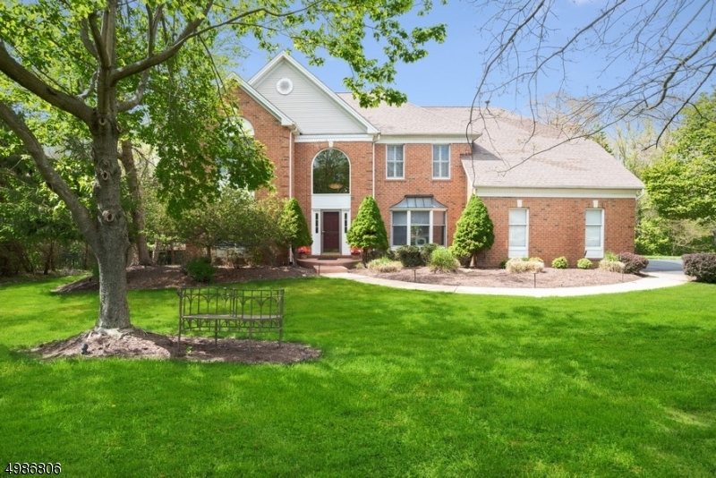 Stunning two-story colonial with breathtaking high ceiling as you enter into the foyer.  Light-filled LR & DR are perfect for entertaining!  Both feature architectural moldings & hardwood floors. The library on the first floor level offers privacy for a home office.  The family room features cathedral ceilings & a built-in woodburning fireplace.  This home offers granite kitchen counterstops & white kitchen cabinets & recessed lighting & sliders to the deck.  The partially finished basement offers an area for any activity with a direct walkout to your private pool.    Next to the pool is the gazebo.  Hardwood floors on 1st level.  Neutral carpet on the second level.  Master bedroom feature tray ceilings, sitting room & luxury bath.  The development also has a biking/walking path and a playground.