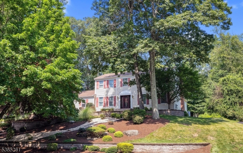 Impeccably maintained colonial with upgraded/updated highlights that include center island  maple kitchen w/custom cabinetry, roll-out shelves and soft close doors and drawers, granite countertops, top of the line SS appliances and under cabinet lighting, very large great room addition with pocket-doors, dual skylights and fieldstone fireplace, all oak doors throughout 1st floor, two car finished garage with epoxy floor and 18' door-wide access, formal living and dining rooms, ceramic tile powder room, as well as mudroom/laundry room. 2nd floor features primary suite with walk-in closet and full bath, 3 additional bedrooms and large hall bath with Jacuzzi shower and jetted tub. Ample storage via garage attic and basement storage area. Finished basement also has crawl space area under great room. Other highlights include newer front porch, 2021 roof, Andersen thermal windows, Peachtree door, whole-house Generac generator with automatic transfer switch, sump pump, radon mitigation system, paver walkways and patio, hardwood flooring throughout, Belgian block curbing, 16x12 storage shed, lighted gazebo, central vacuum, 3 zone baseboard hot water heat and one zone central air conditioning, as well as whole house fan, natural gas heat, 5 dual smoke/CO sensors, public water, sewer, 10 zone irrigation system, landscape lighting, and so much more! Tremendous location - 5 minutes to Chester. Fantastic Long Valley Schools and top-rated West Morris Central High School with lB Program.