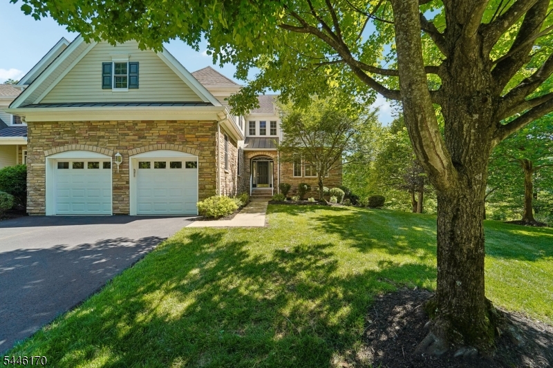 Rare Delano end-unit in sought-after Bel Air at West Orange. This is an award-winning, Energy Star rated community. This exceptional home offers protected woodland views and an elevated living experience throughout. A private Elevator grants effortless access to every level. The chef's eat-in kitchen impresses with a large island, fireplace, sliders to composite deck, overlooking protected woodland views, butler's pantry with wet bar. Retreat to the primary suite, featuring a private sitting room, dual-sided fireplace, exquisite bath and two custom-fitted walk-in closets. The finished walk-out lower level adds versatile living space with a full bath, ideal for guests or recreation. Enjoy resort-style amenities at the community's newly renovated 7,800 sq ft clubhouse, professionally designed and decorated, featuring a newly renovated pool, hot tub, Pickle Ball, Tennis courts and a fully equipped gym. An exceptional offering of privacy, craftsmanship and refined design.